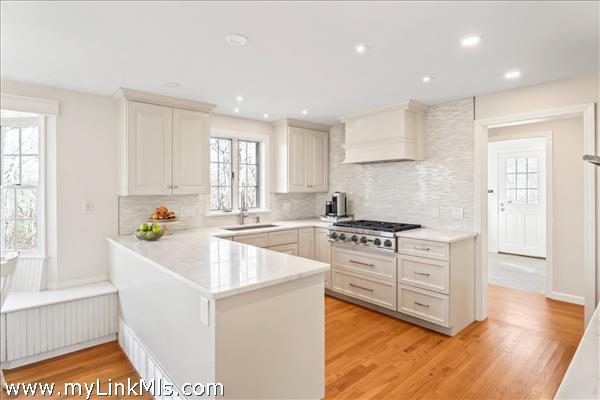 2023 kitchen renovation - Quartzite counters, natural stone mosaic backsplash