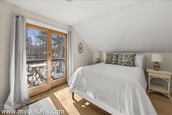 primary bedroom with a private balcony...