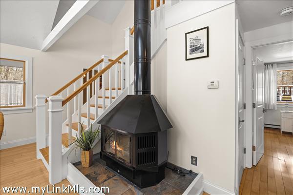 Wood-burning stove adds ambiance to this inviting room
