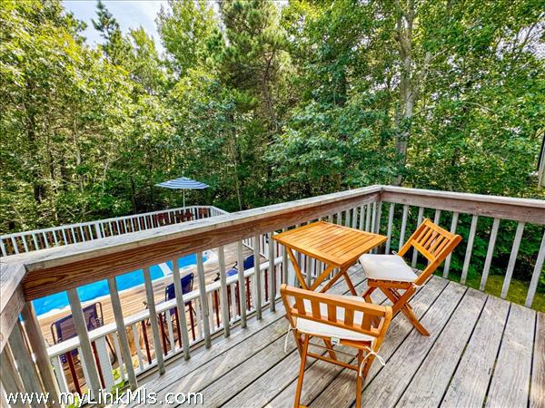 Primary bedroom balcony overlooking the swim spa