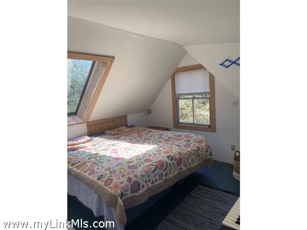 Partial view:  Guest House bedroom. There is an adjacent sitting room.