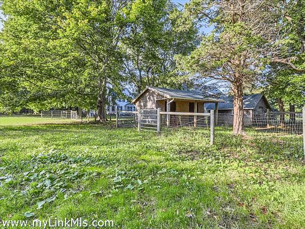 2 bay horse barn, chicken coop and then separate primary barn