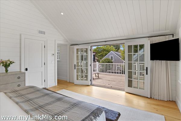 Primary bedroom suite with private balcony