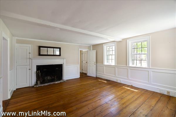 A third fireplace in the living room at the front of the house