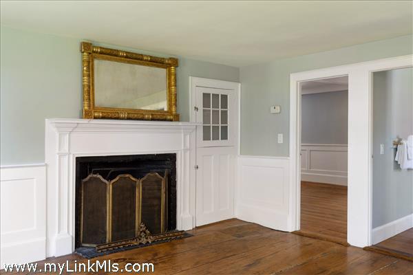 Family room with historic King's board flooring and second fireplace