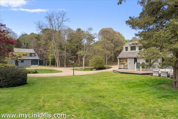 View of the main house and carriage house beyond