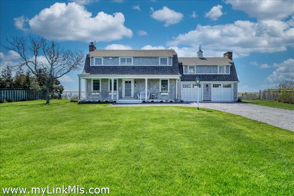 Beautifully landscaped grounds featuring a vast level lawn.