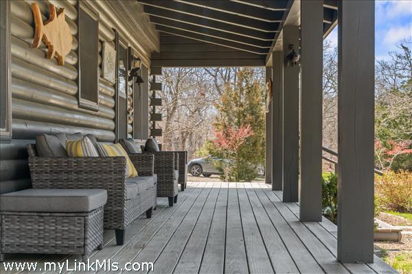 Guest house front porch furnished for relaxation