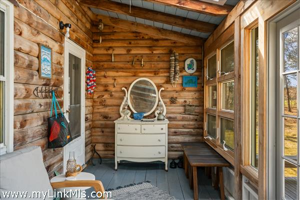 Main House has so many charming places to gather - enclosed three-season porch