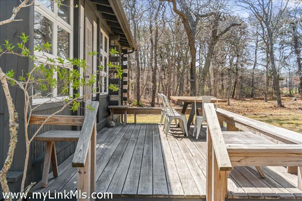 Main house front deck with bench seating and dining for 10 or more