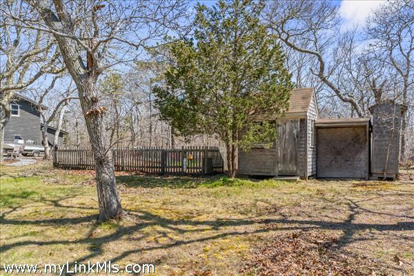 Picket fence around a kitchen garden area waiting for your vision - garden shed and additional storage