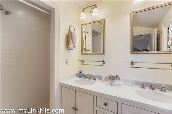 with double sinks and marble countertop