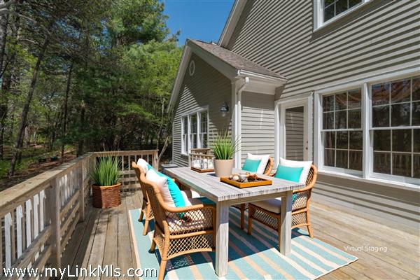 Large deck abutting private wooded area