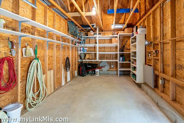 Garage with custom shelving and lots of storage space