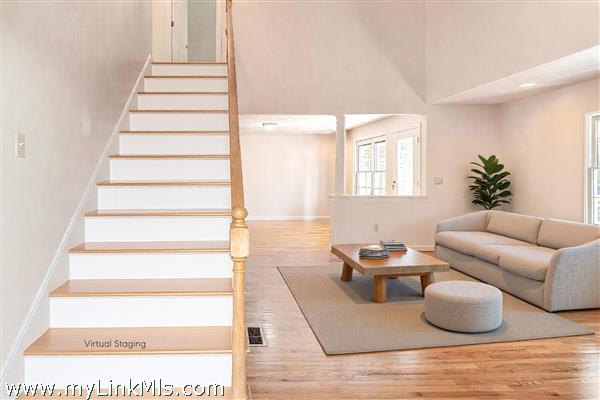 Front entry with stairs to two more bedrooms