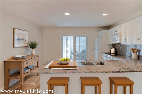 Granite countertops. Ample room for stools at the Peninsula.