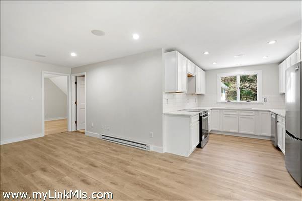 Apartment above the garage has full kitchen, living/dining area, full bath and bedroom. Mini-split heat/AC and washer/dryer. Two separate entrances.