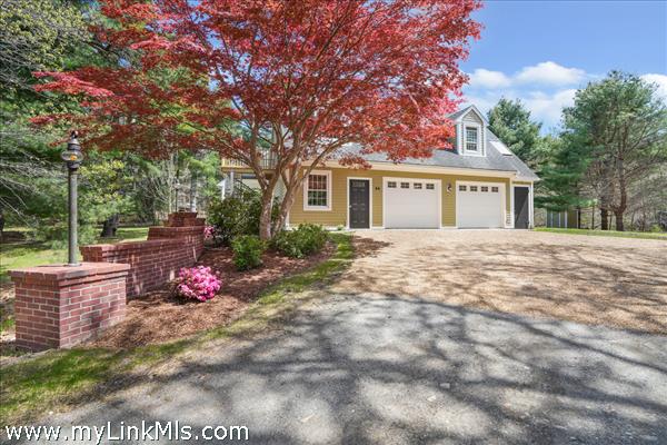 Large 2-car garage with mud room and lots of storage, parking for multiple vehicles.