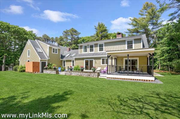 Large, level backyard with room for an in-ground pool. Screened in porch, deck, patio and outdoor shower. Newly seeded lawn virtually touched up.