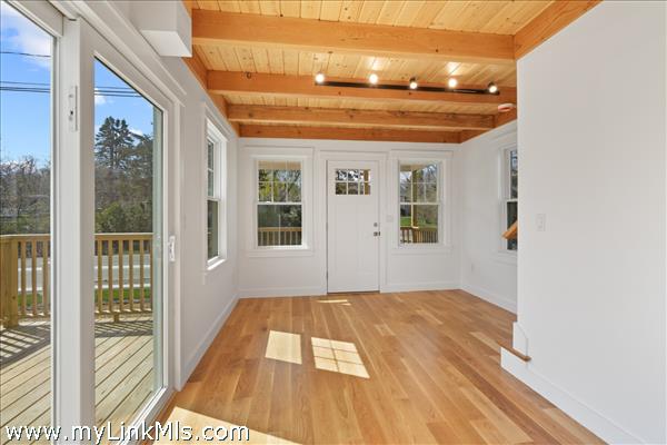 Main living and outdoor deck in primary unit.