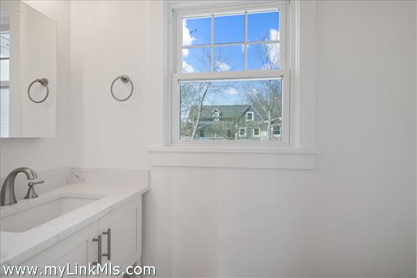First floor powder room in primary unit.