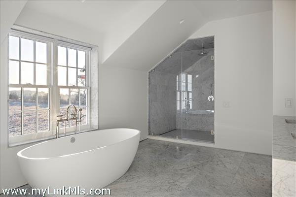 The Farmhouse Primary Bathroom with custom Carrara marble