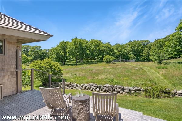 Enjoy your morning coffee or evening cocktails from the back deck looking out over the meadow.