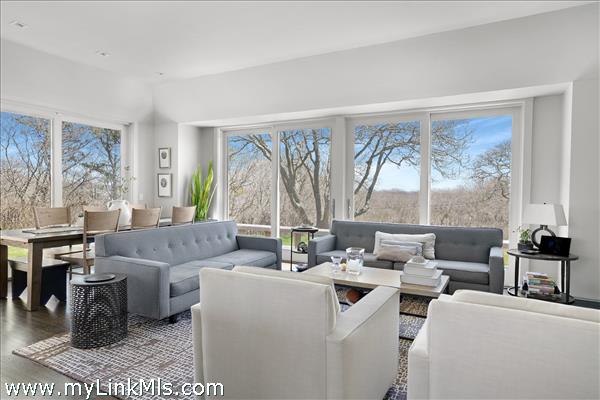 High ceilings and large windows fill the great room with natural light.
