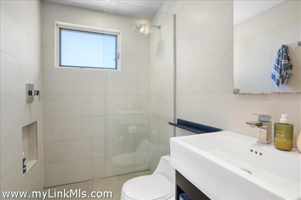 Two renovated bathrooms are shared by the three bedrooms.