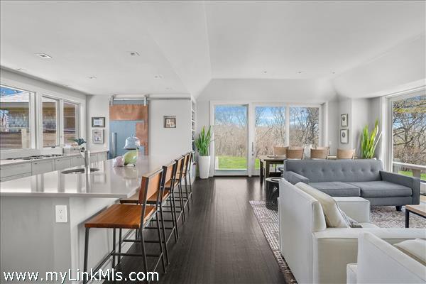 Generous open concept kitchen, living and dining space.