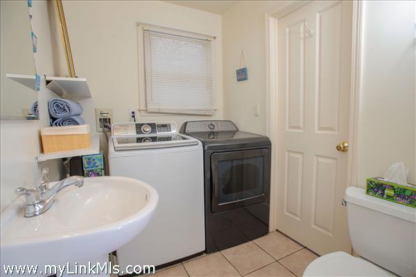 First floor bathroom with washer and dryer