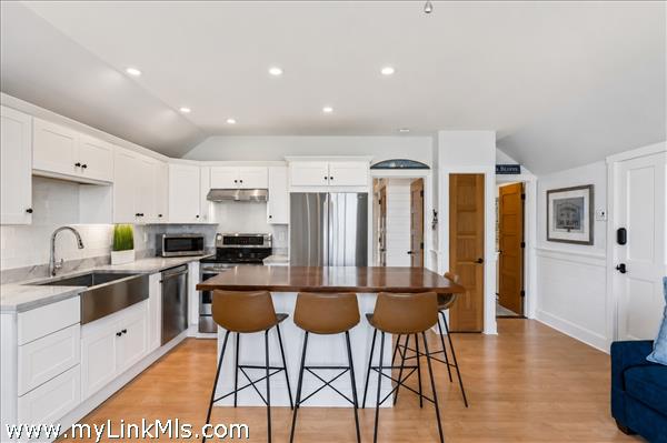 Kitchen with bedroom door, bathroom door and entrance door to right
