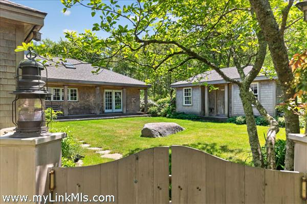Step thru the gate that welcomes you with an open-air garden courtyard