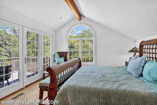 Sun-drenched primary suite with a dedicated office/sitting area