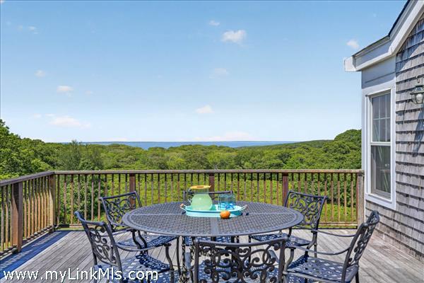 Expansive deck overlooking the rolling hills and Vineyard Sound