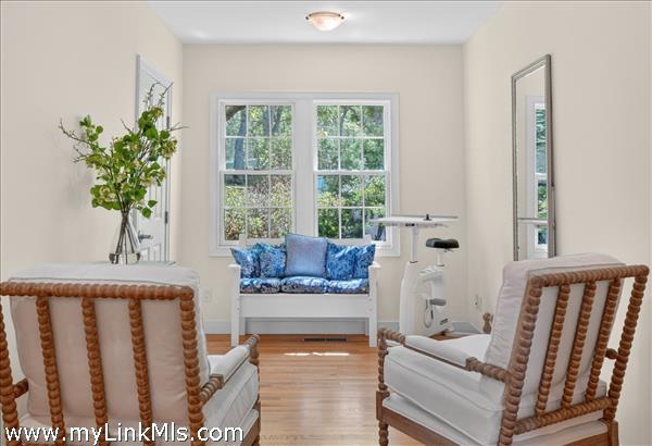 A bright, serene sitting area designed for quiet contemplation, reading, and reflection
