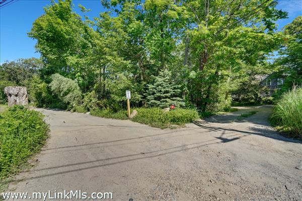 Driveway on right and beginning of separate lot