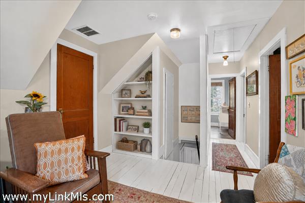 Second floor flex space and hallway to bedrooms and shared bath