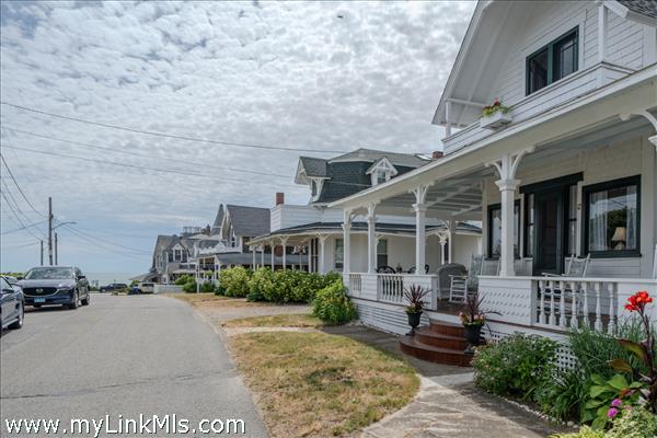 Welcoming wrap around porch extending along the fron and side of home.