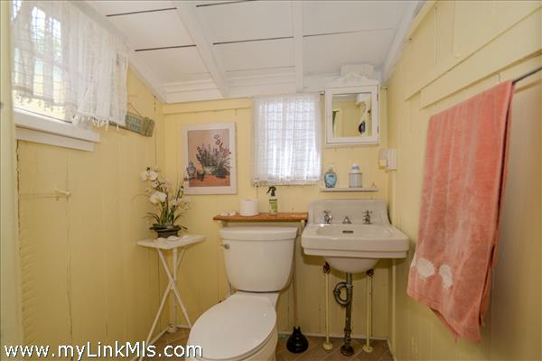 Quaint cottage half bath with classic character