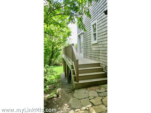 stairs to deck and french door kitchen entry