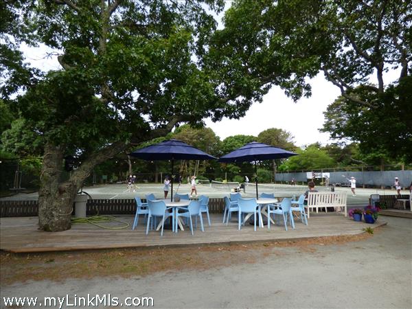 Tennis court. Sitting area to watch the games.