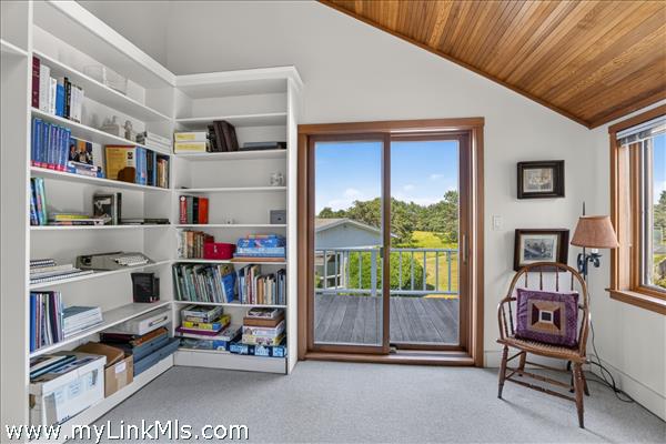 The fourth bedroom has a private balcony.