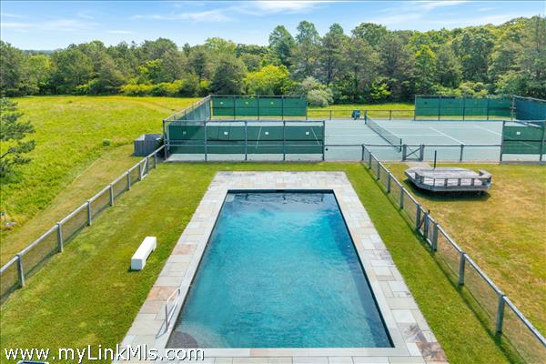 Heated pool and private tennis court.
