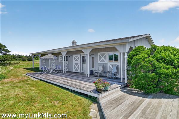 The post and beam guest house has two bedrooms.