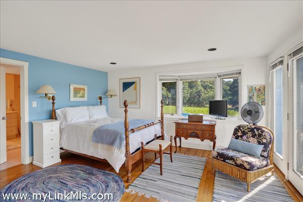 First floor primary with meadow views.