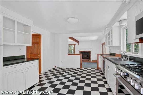 Open kitchen that leads to sunken living/dining area