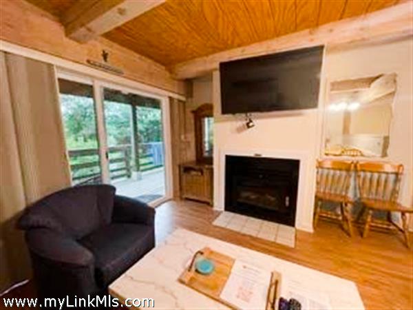 open living concept with fireplace and tv