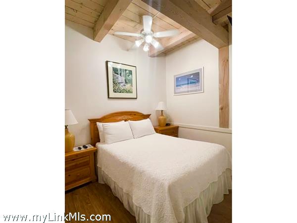 Main bedroom has beautiful wood ceilings