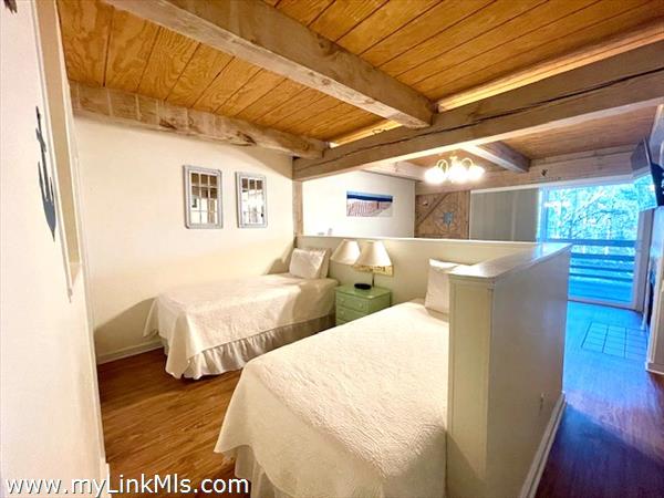 two twin beds in sectioned off sleeping area